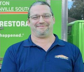 Brad Clark Project Manager SERVPRO Jacksonville South, male with blue shirt and glasses