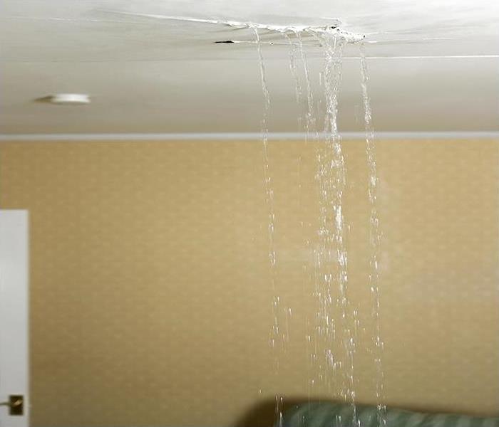 water spilling from a ceiling