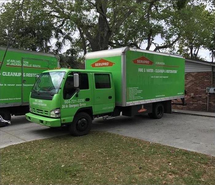 One of our green box trucks in the driveway of this property